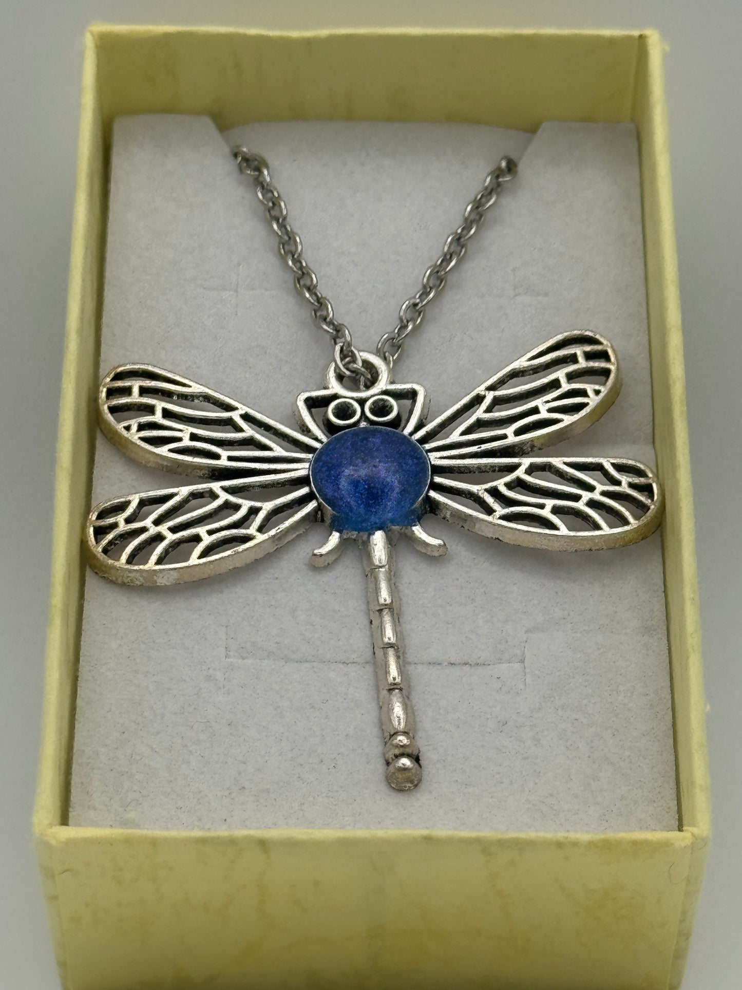Necklace with metal dragonfly with blue resin, on stainless steel chain