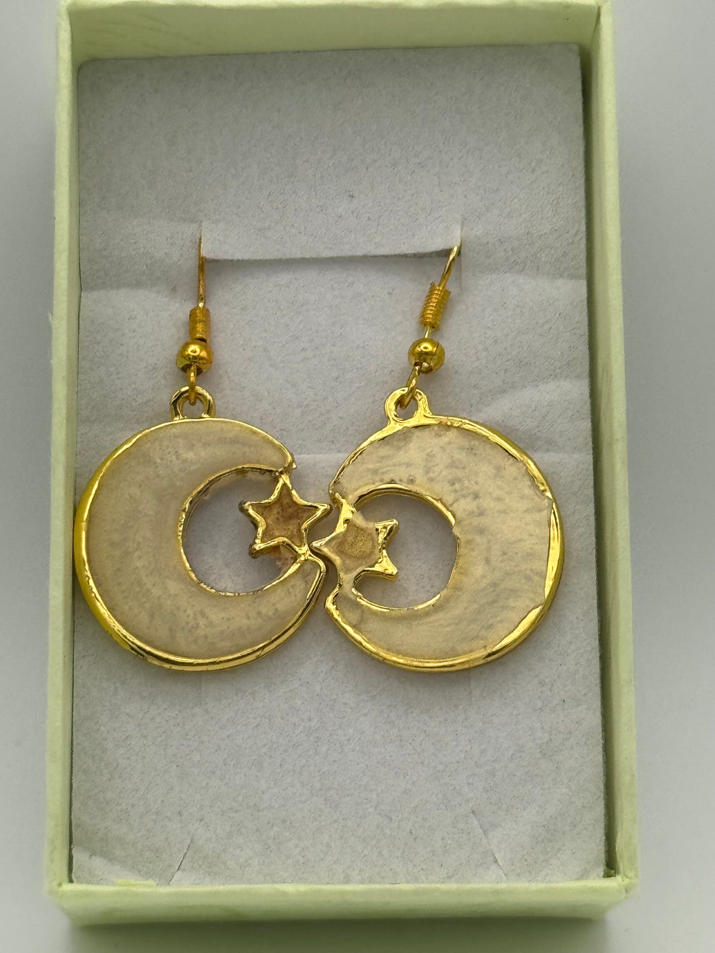 Cream resin with gold coloured moon and star bezel earrings