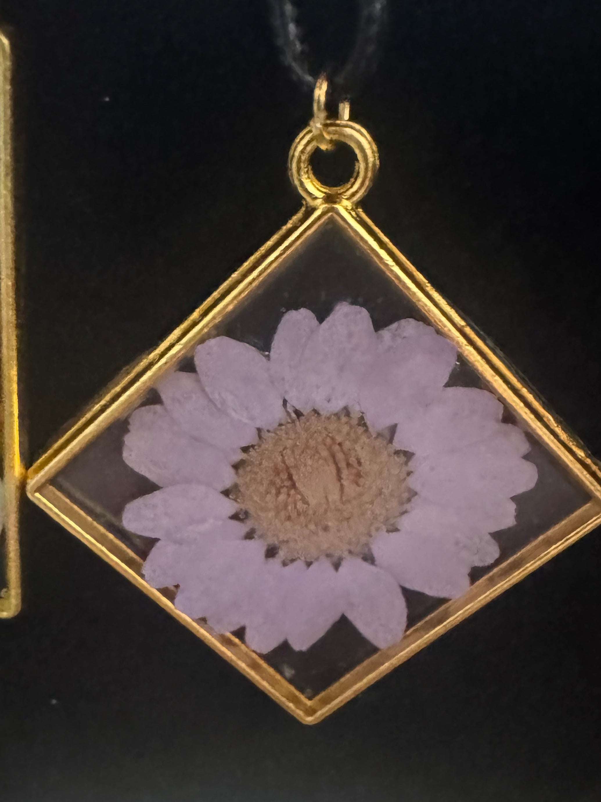 Necklace with metal bezel and flower inlay