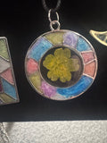 Circular metal bezel and resin necklace