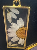 Necklace with metal bezel and flower inlay