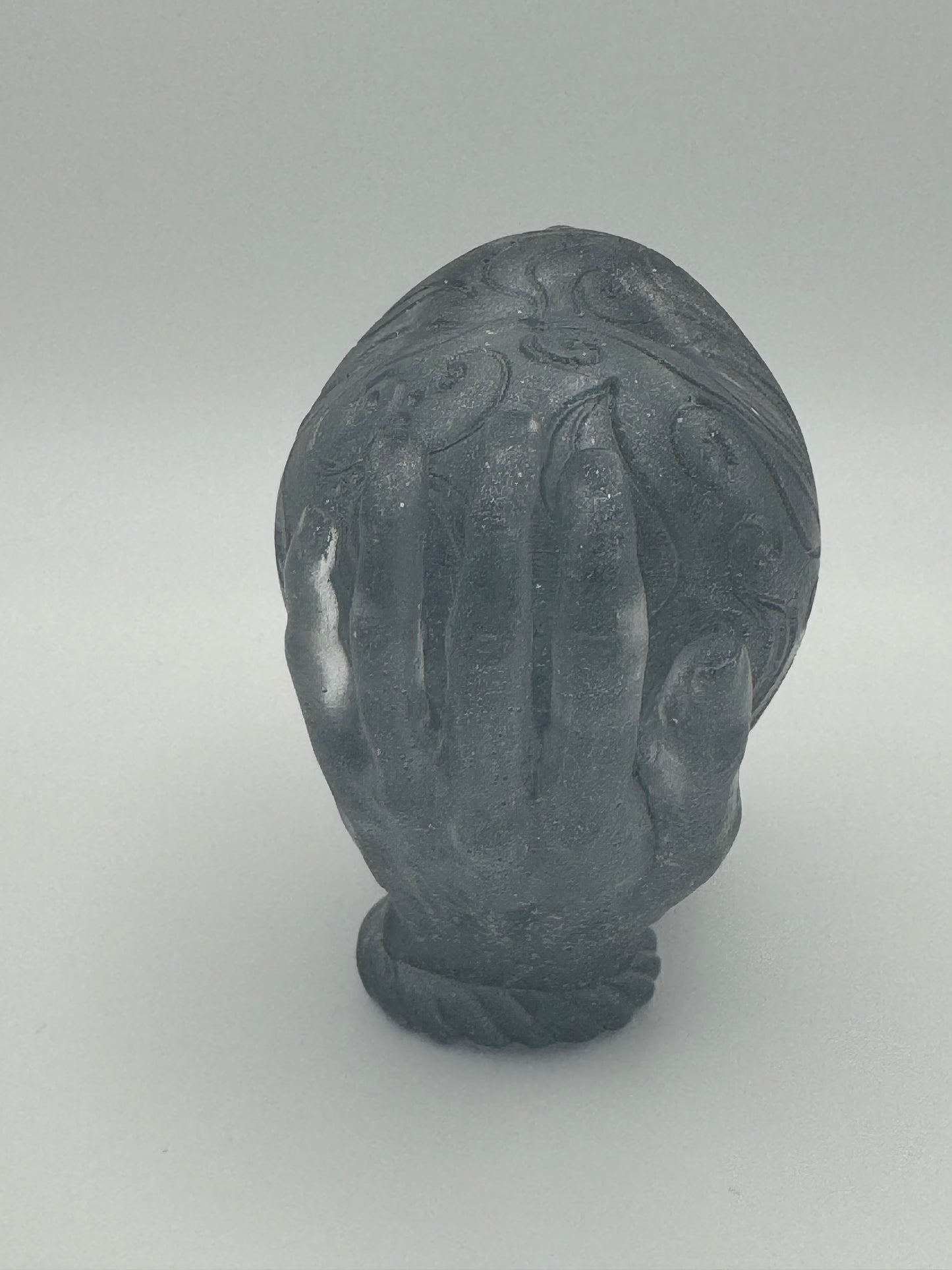 Silver resin ornament, hands holding heart