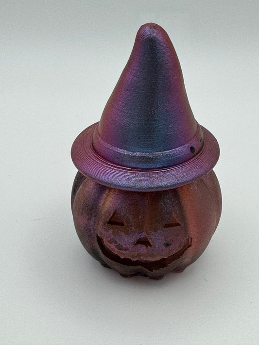 Resin pumpkin wearing witches hat