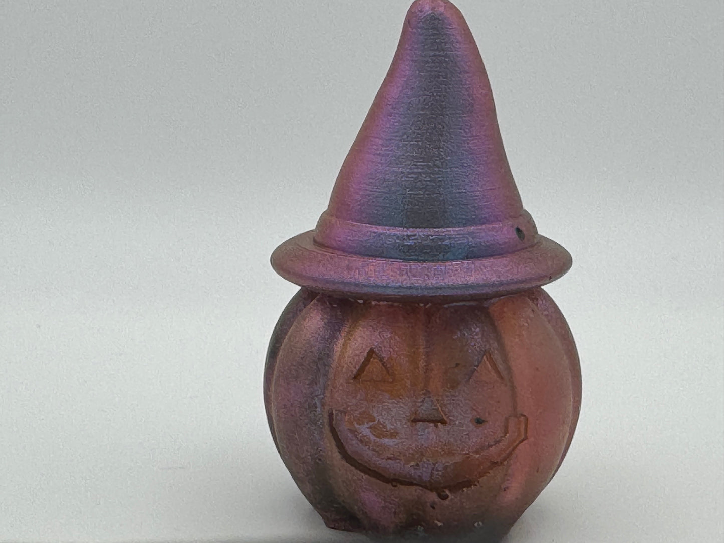 Resin pumpkin wearing witches hat