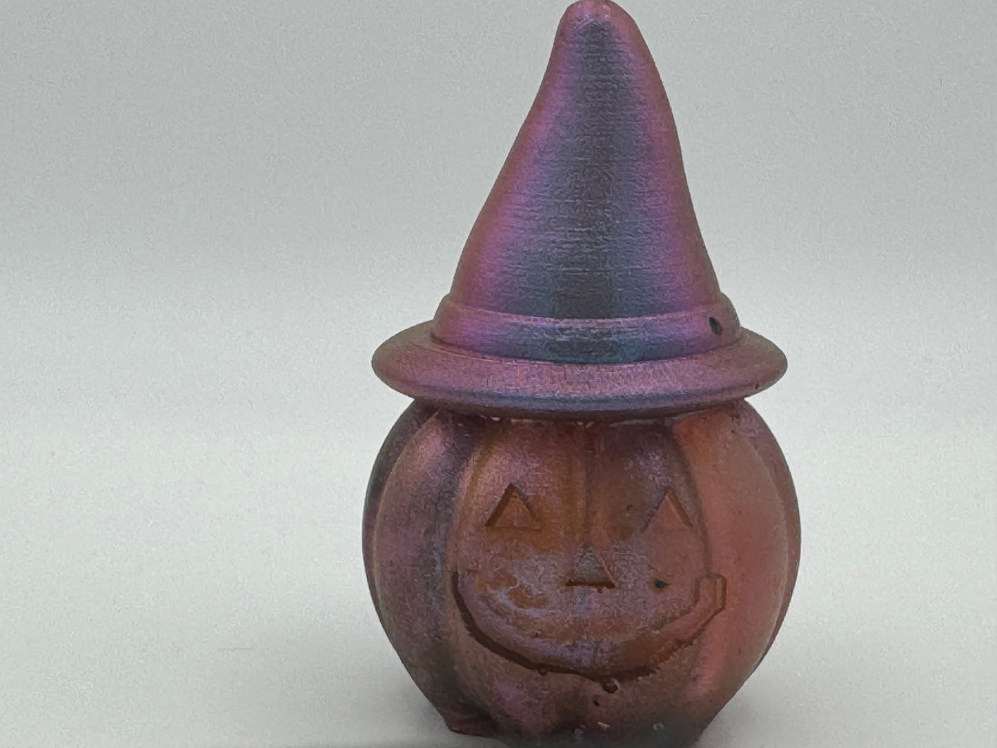 Resin pumpkin wearing witches hat