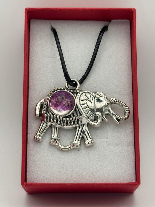 Necklace with metal elephant bezel and purple flower in resin, on a black waxed chain