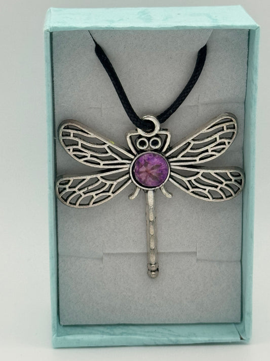 Necklace with metal dragonfly with purple resin and black waxed chain