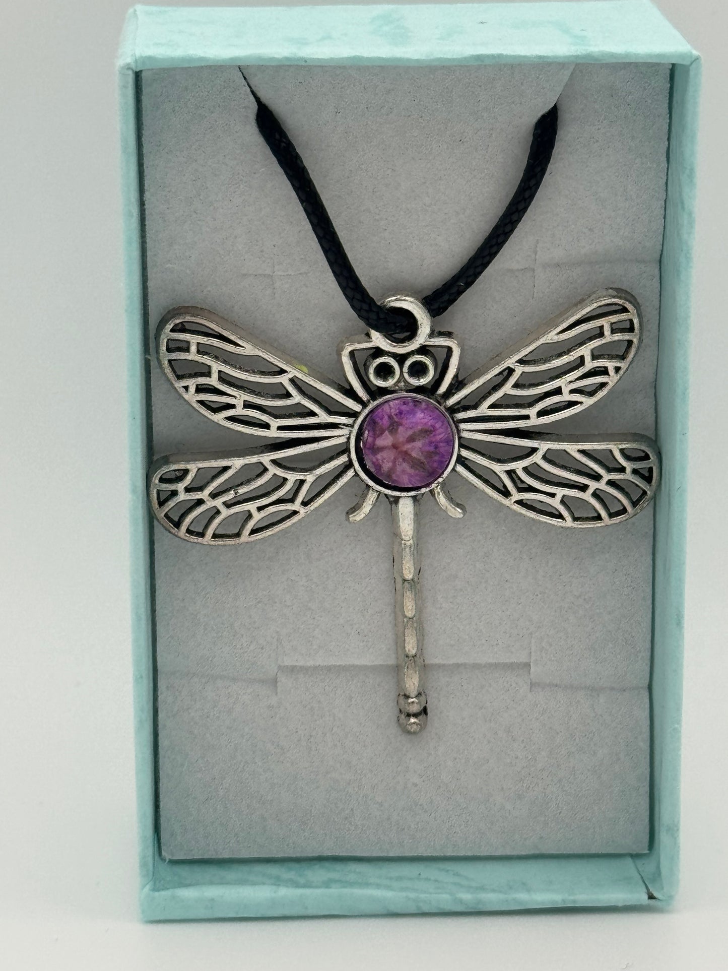 Necklace with metal dragonfly with purple resin and black waxed chain