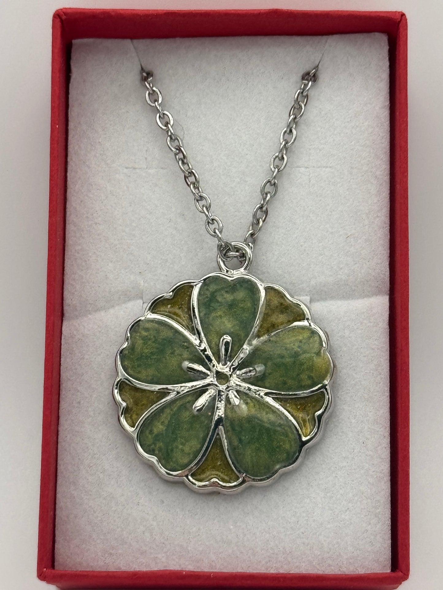 Green resin and metal bezel necklace on stainless steel chain