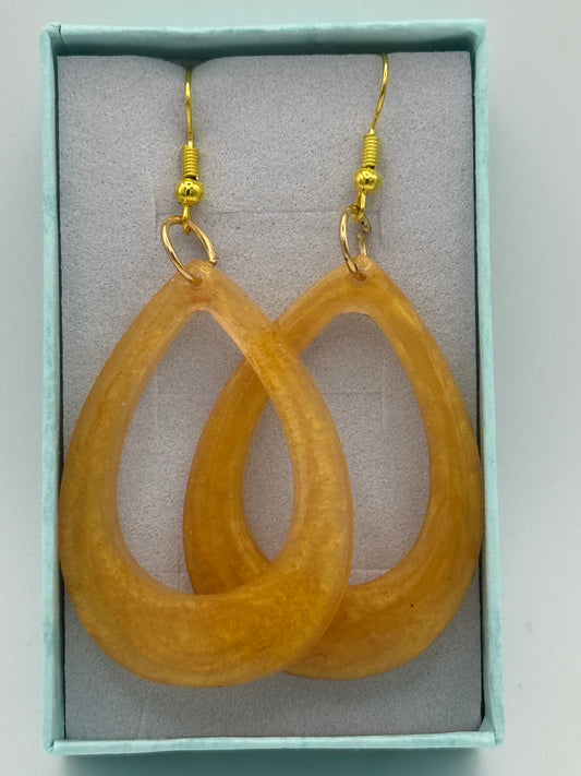 Gold coloured resin long earrings