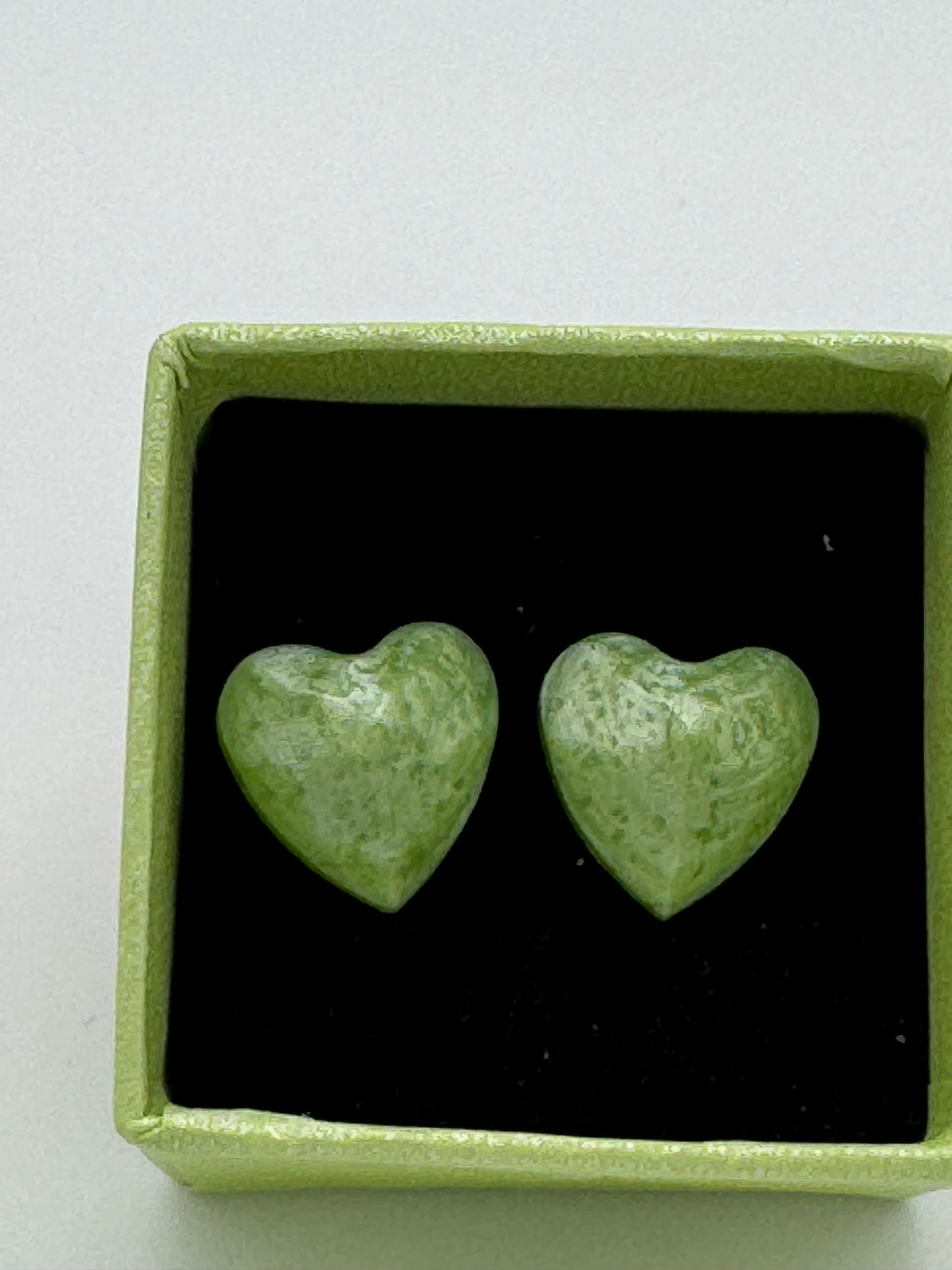 Green resin heart shaped stud earrings